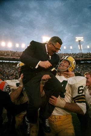 Kramer carriers Vince Lombardi on his shoulders after winning Super Bowl II.